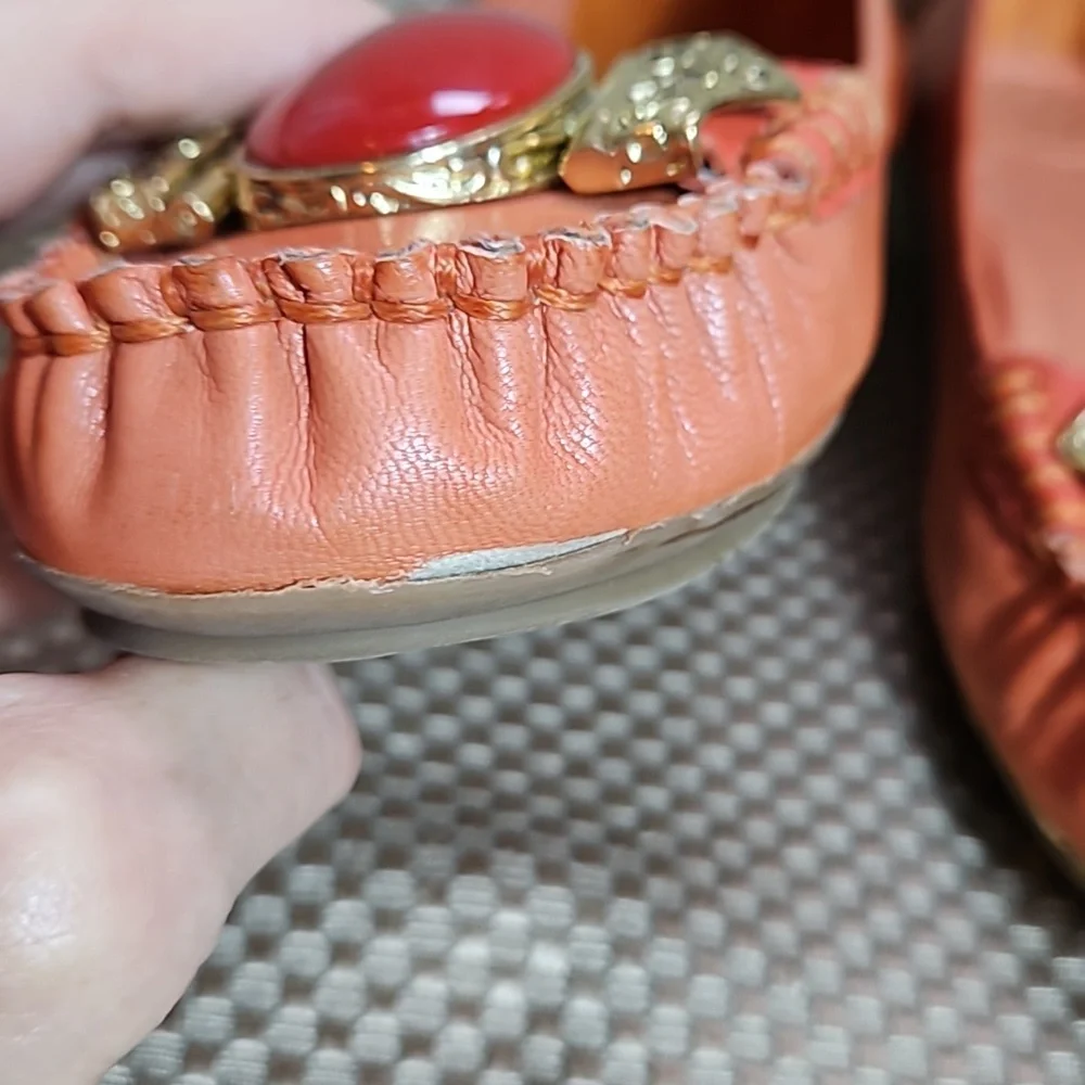 BCBG Leather Loafers.  Gold Embellishment with Coral Colored Jewel.  Size 6.5 B